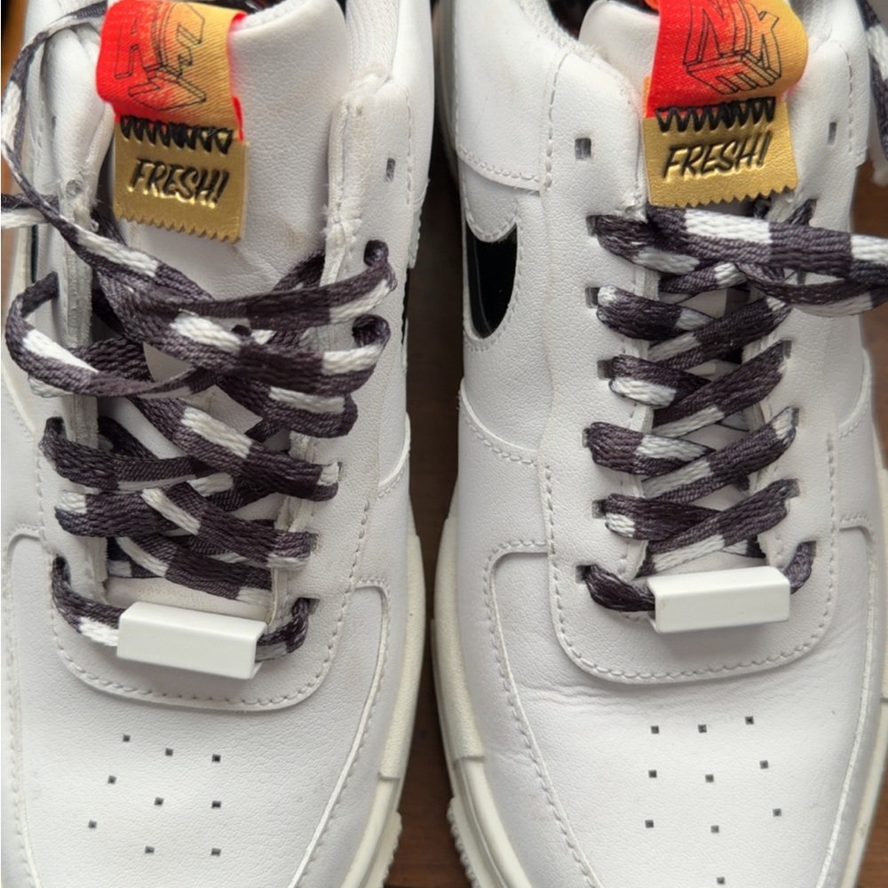 Nike Men’s White Leather Sneakers with Black Swoosh and Multicolor Tongue